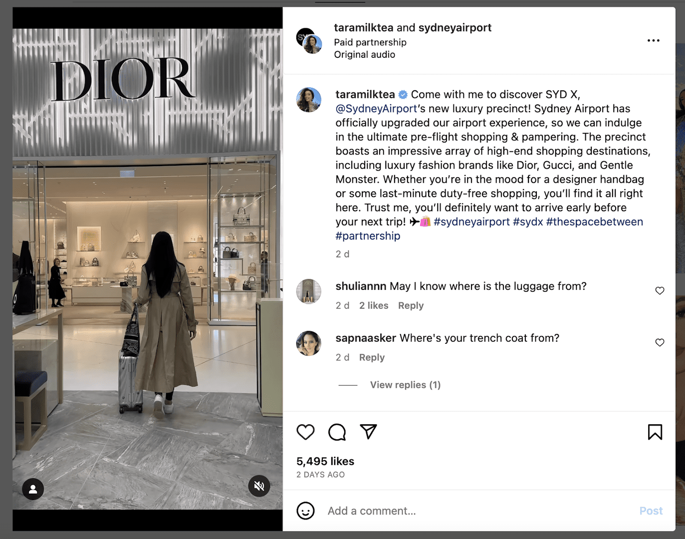 a woman is standing in front of a dior store